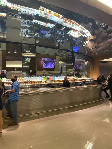 Mirrored concourse bar in the Owners Club with a full top shelf