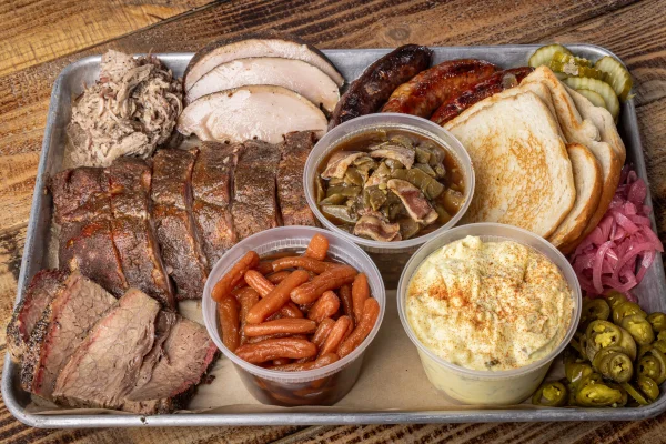 Strouderosa family barbecue feast with smoked meats, green beans, carrots and potato salad