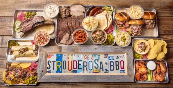 Strouderosa BBQ menu spread with smoked meats, sandwiches, wings, nachos and homestyle sides