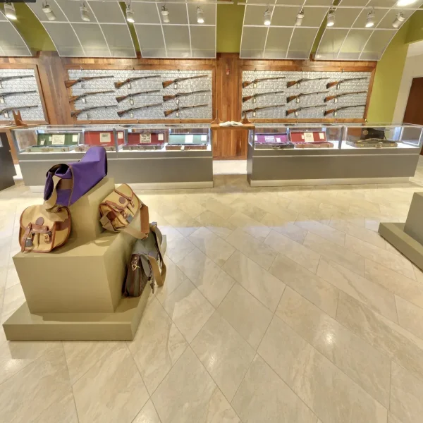 Frisco Gun Club - Fine shotguns and leather shooting bags in the gallery showroom - DallasVIP